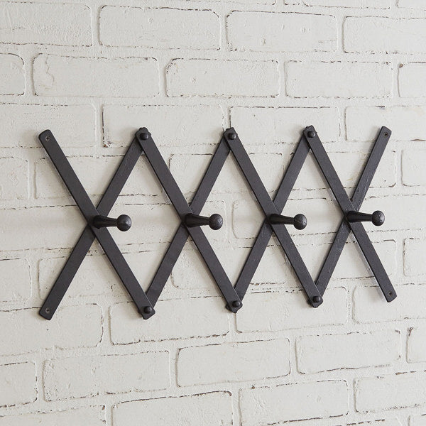 black metal accordian wall rack with hooks