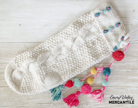 cable knit wool stocking with tassels and poms