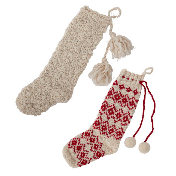 red and white scandinavian style hand knit wool stockings with pom tassles