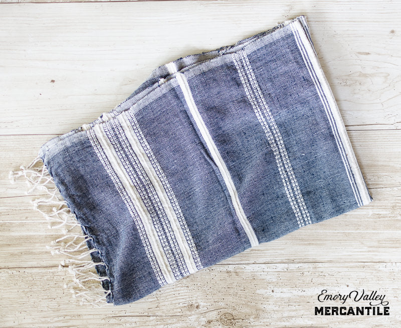 ehtically crafted blue and white kitchen towel with fringe