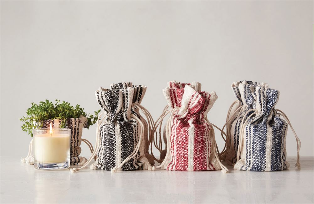 Orange Vanilla Candles with striped grain sack bag