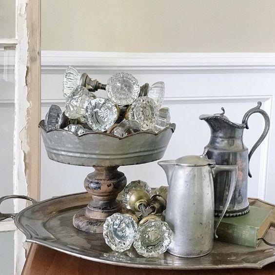 farmhouse metal pedestal with vintage glass doorknobs