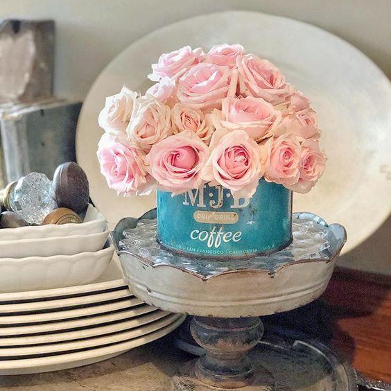 farmhouse metal pedestal with pink roses in vintage aqua coffee can