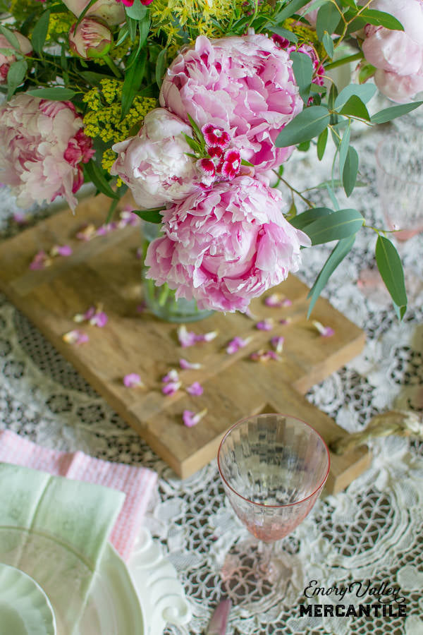 peony centerpiece with wood cheese board for base