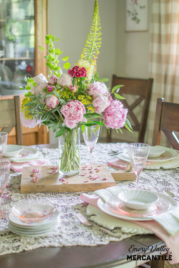 peony centerpiece with wood cheese board for base