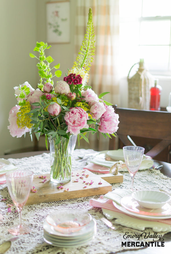 peony centerpiece with wood cheese board for base