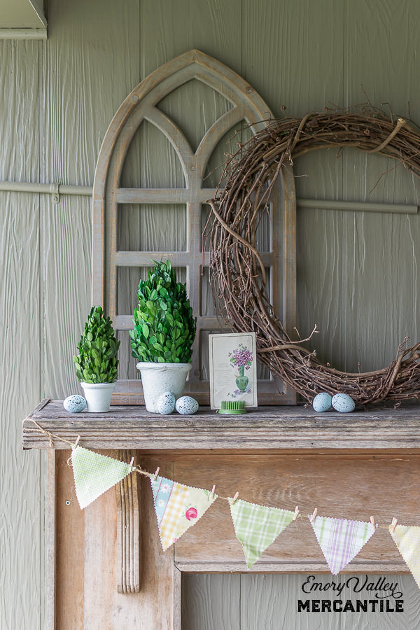 preserved boxwood topiary with rustic spring mantel decor