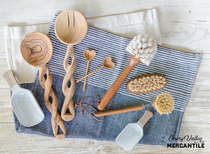 hand carved wooden spoons with wood handled kitchen brushes and porcelain scoops