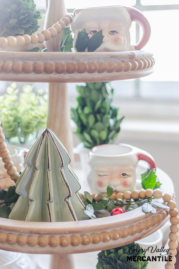 three tiered wood stand tray with beaded edge decorated for Christmas