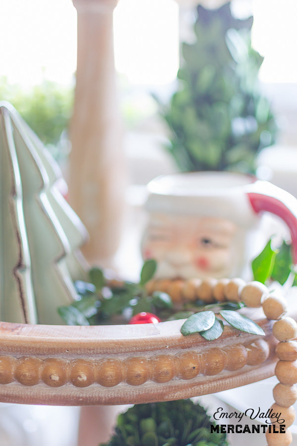 three tiered wood stand tray with beaded edge decorated for Christmas