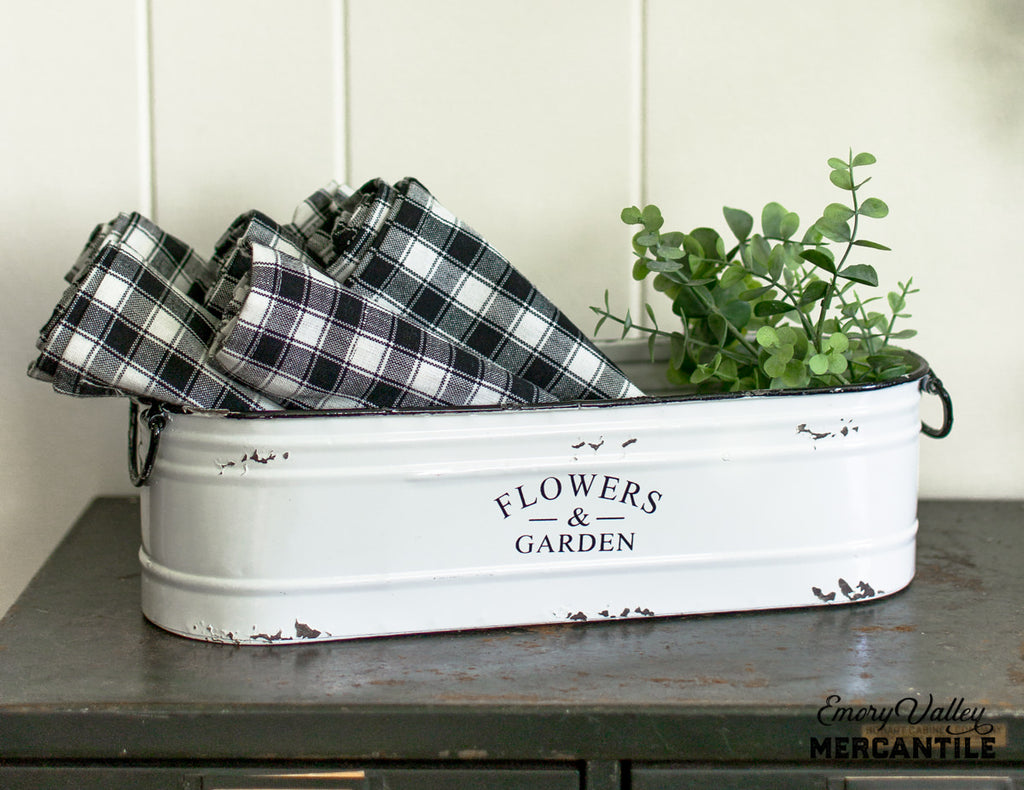 white enamel flowers and garden bin