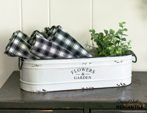 white enamel flowers and garden bin