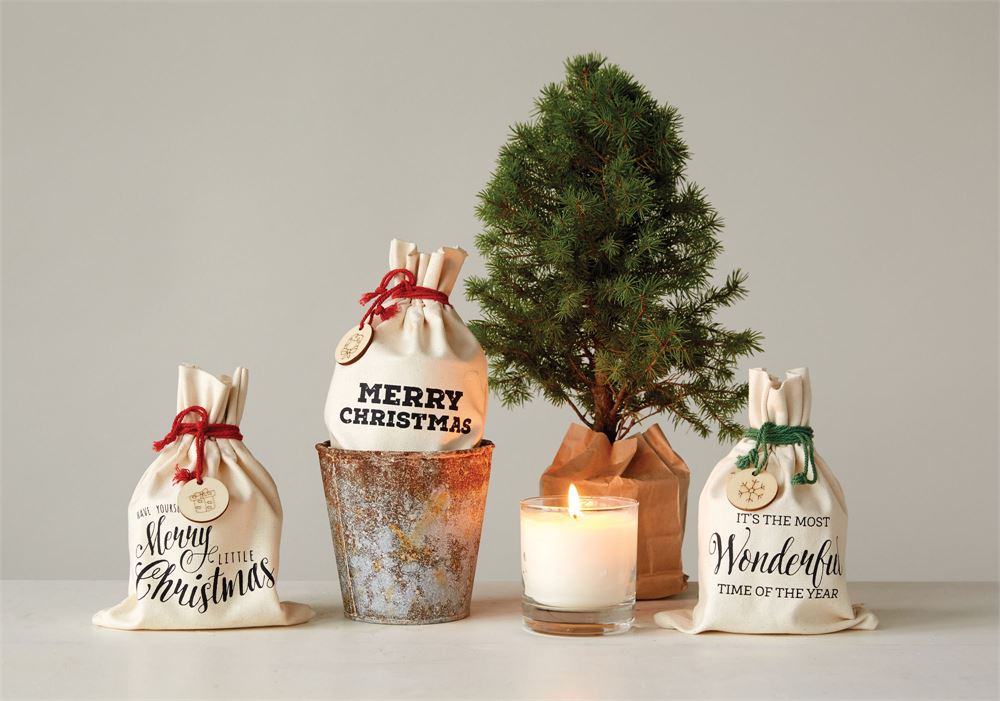 festive Christmas scented candles in gift bag with wood slice charm