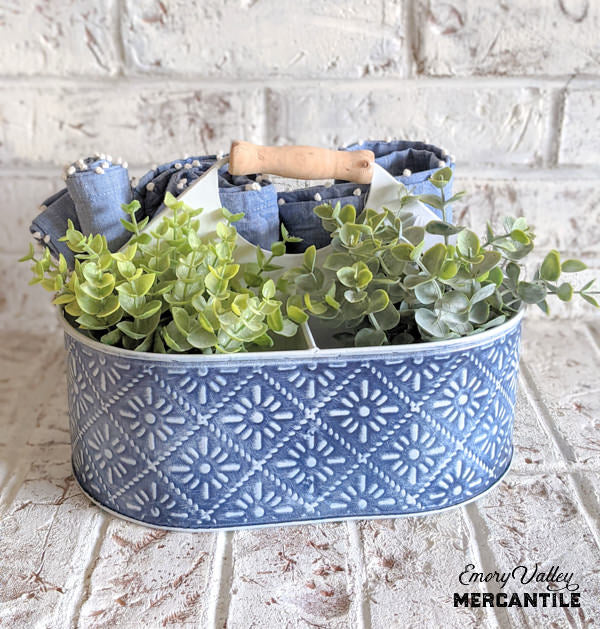 blue and white metal embossed divided caddy with wood handle