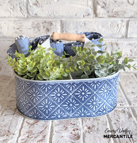 blue and white metal embossed divided caddy with wood handle