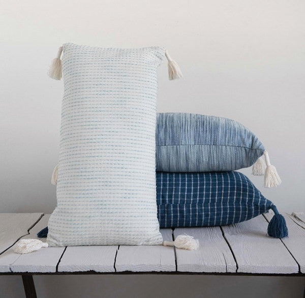 blue pillows with tassels