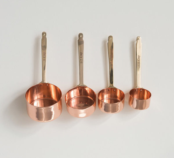 copper and brass measuring cups