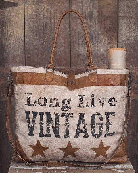 Long live vintage canvas and leather tote
