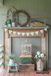 rustic mantel with wooden tool caddy and spring decor