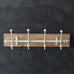 wooden wall rack with white hooks